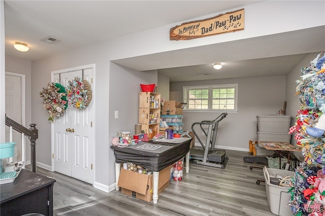 recreation room featuring hardwood / wood-style flooring