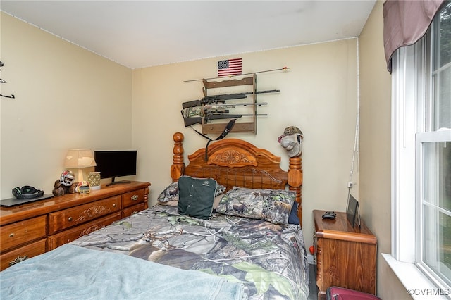 bedroom featuring multiple windows