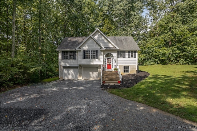 bi-level home featuring a front yard and a garage