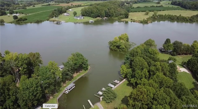 aerial view with a rural view and a water view