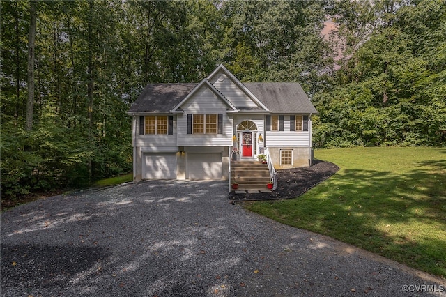 split foyer home with a garage and a front lawn