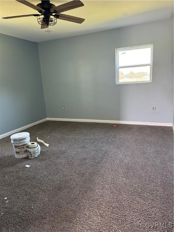 empty room featuring carpet and ceiling fan