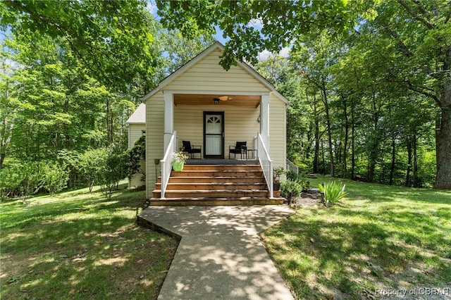 bungalow-style house with covered porch and a front lawn