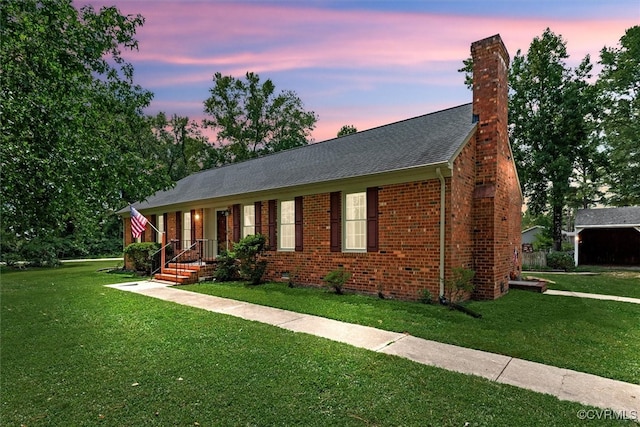 view of front of house with a yard