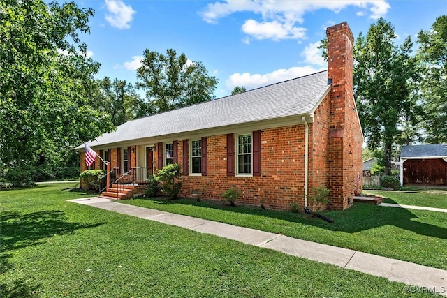 ranch-style house featuring a front yard