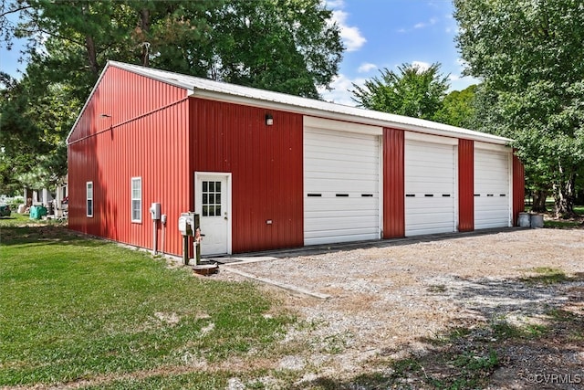 garage featuring a lawn