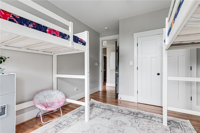 bedroom with hardwood / wood-style flooring