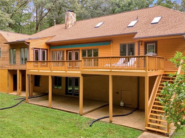 rear view of property with a deck