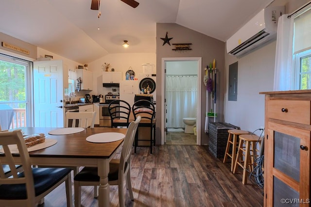 dining room featuring lofted ceiling, dark wood-type flooring, ceiling fan, and a healthy amount of sunlight