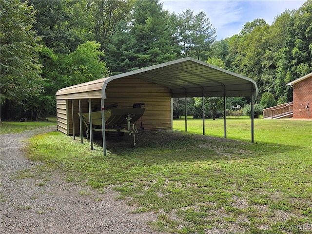 exterior space with a lawn and a carport