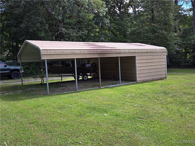 view of outbuilding with a lawn and a carport