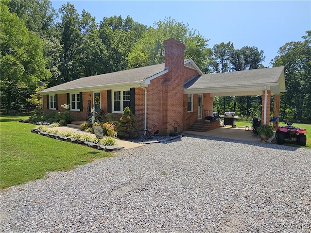 ranch-style home featuring a front yard