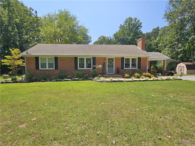 single story home with a storage shed and a front yard