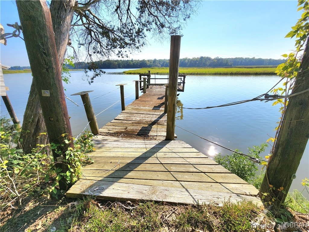 dock area featuring a water view