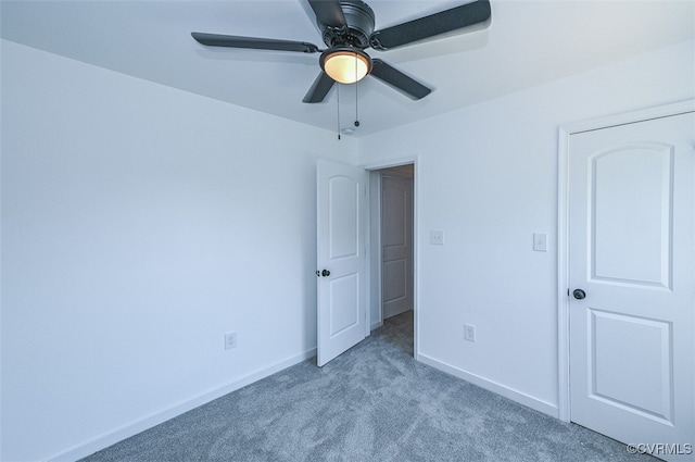 unfurnished bedroom with light colored carpet and ceiling fan