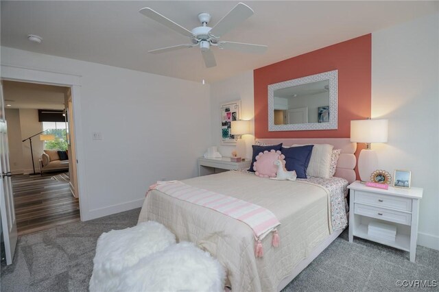 bedroom featuring a ceiling fan, baseboards, and carpet floors