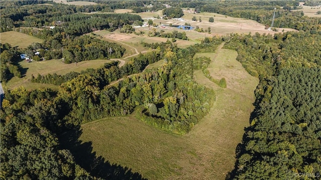 bird's eye view featuring a forest view