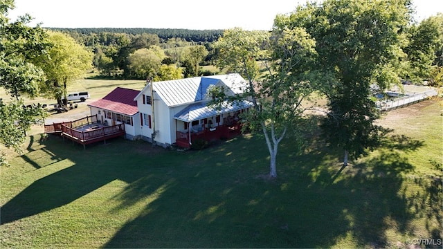 drone / aerial view featuring a forest view