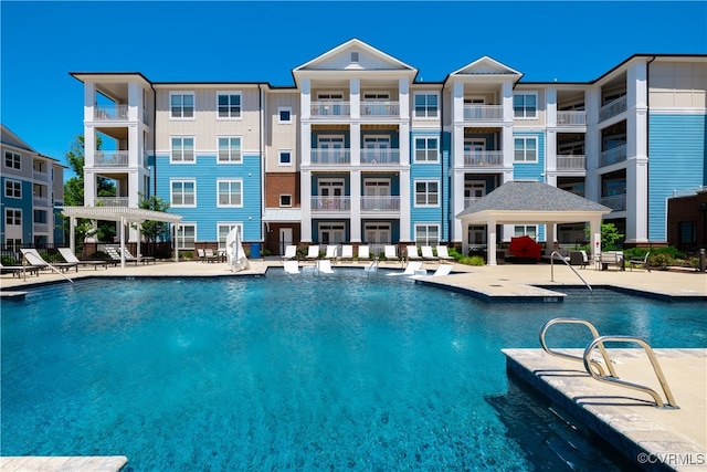 view of swimming pool featuring a patio area