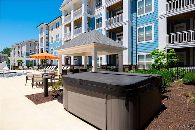 exterior space featuring a jacuzzi and a patio