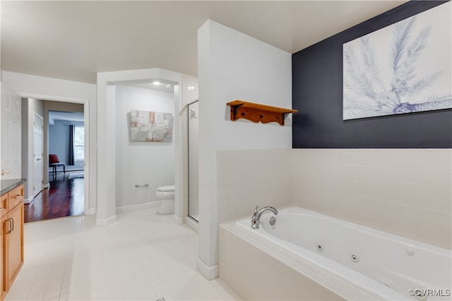 full bathroom featuring shower with separate bathtub, vanity, toilet, and tile patterned floors