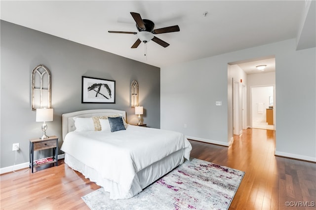 bedroom with ceiling fan and hardwood / wood-style floors