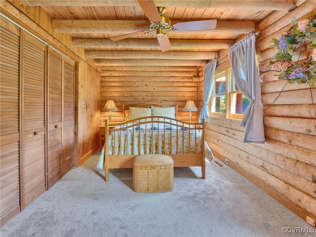 carpeted bedroom featuring wooden ceiling, ceiling fan, beamed ceiling, and log walls