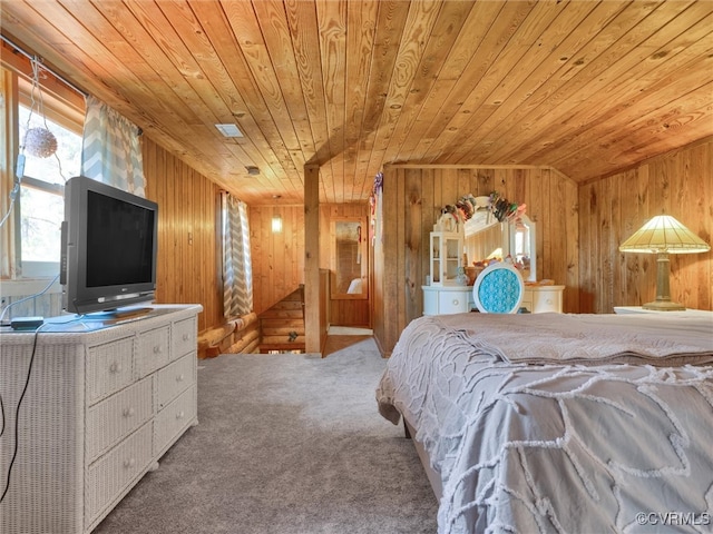 carpeted bedroom with wooden ceiling, wooden walls, and vaulted ceiling