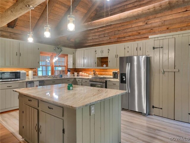 kitchen with wood ceiling, hanging light fixtures, a kitchen island, stainless steel appliances, and lofted ceiling with beams