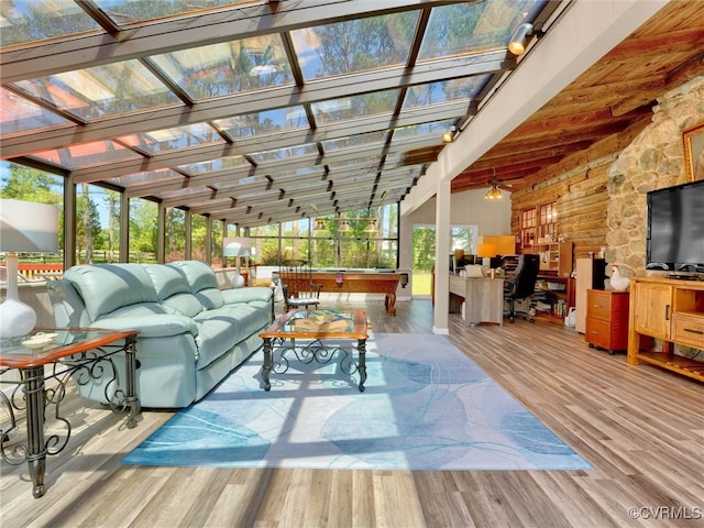 sunroom with pool table and lofted ceiling with beams