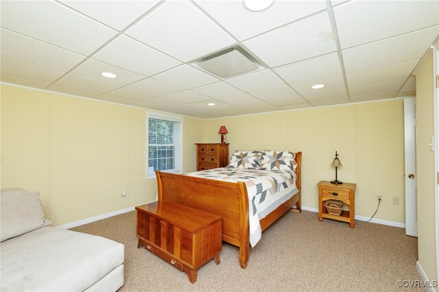 carpeted bedroom with a paneled ceiling