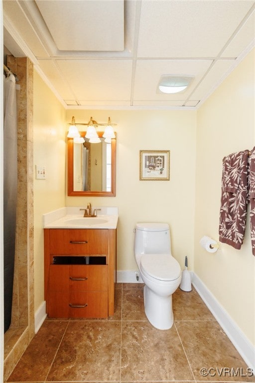 bathroom featuring vanity, toilet, and curtained shower