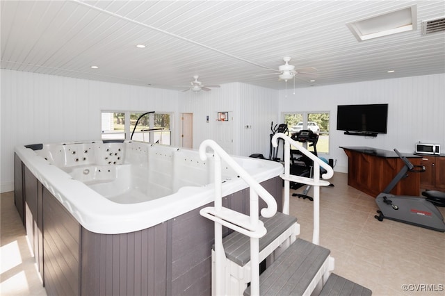 kitchen featuring a wealth of natural light, ceiling fan, and light tile patterned floors