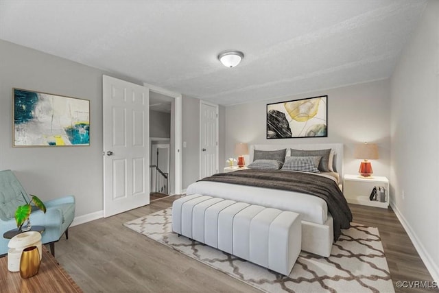 bedroom with hardwood / wood-style flooring