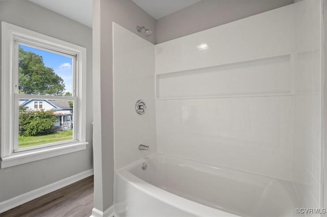 bathroom featuring  shower combination and hardwood / wood-style floors