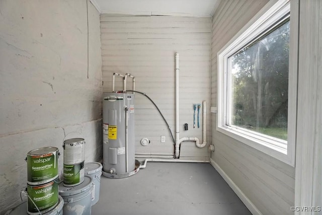 utility room featuring water heater