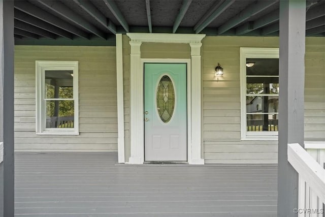 property entrance with covered porch