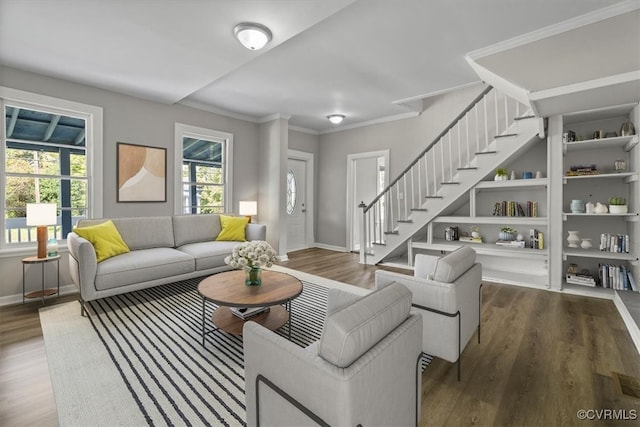 living room with ornamental molding and hardwood / wood-style flooring