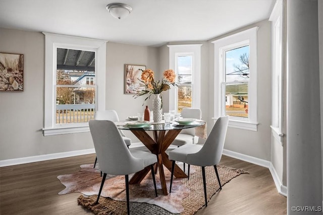 dining area with hardwood / wood-style floors