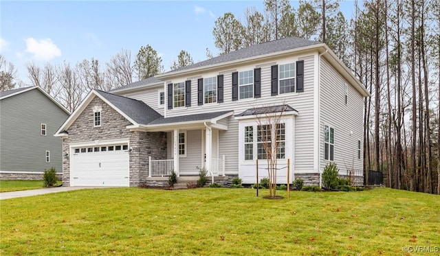 view of front of home featuring a front yard and a garage