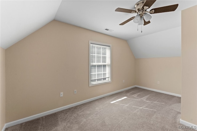 bonus room with ceiling fan, light carpet, and vaulted ceiling