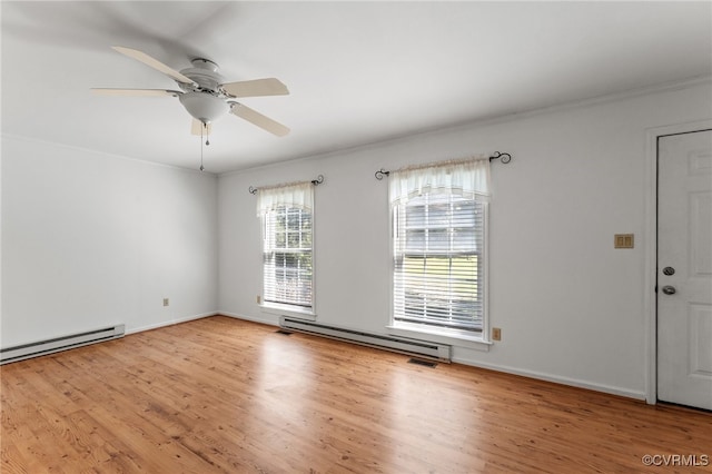 spare room with crown molding, a baseboard radiator, ceiling fan, and light hardwood / wood-style flooring