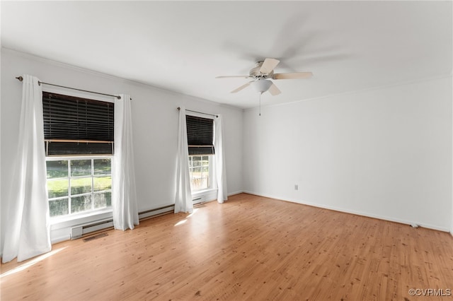 unfurnished room featuring crown molding, a baseboard radiator, ceiling fan, and light wood-type flooring