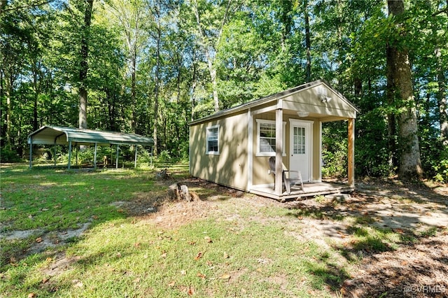 view of outbuilding with a yard and a carport