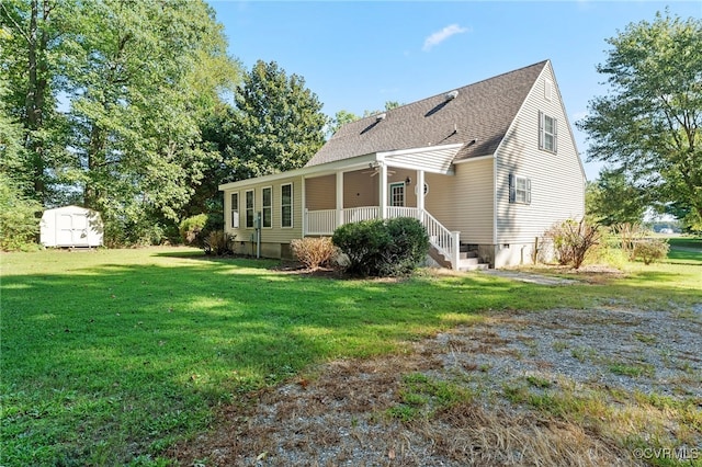 view of side of home featuring a lawn and a storage unit