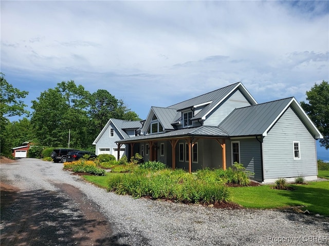 view of front of home with a garage and covered porch