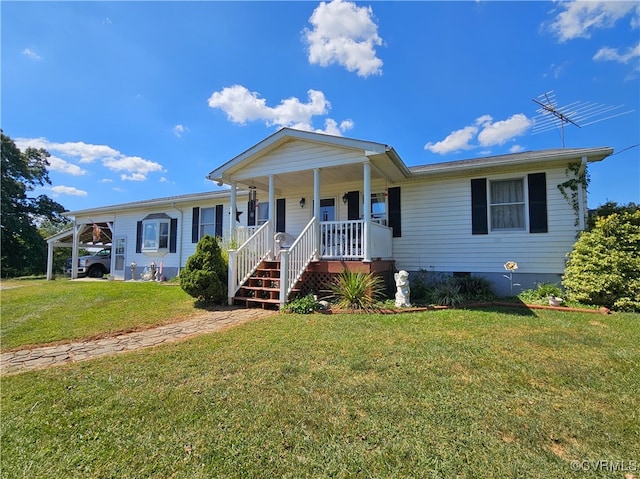 view of front facade with a porch, a carport, and a front lawn