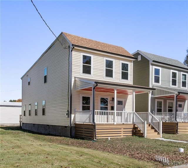 view of front of house featuring a front yard and a porch