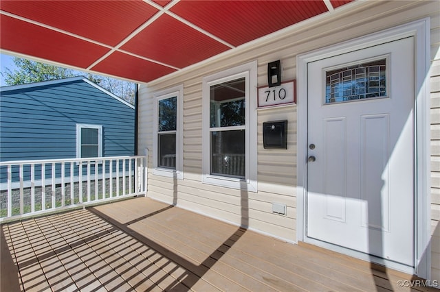 wooden terrace featuring covered porch