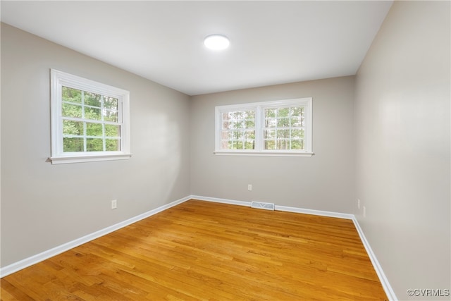 spare room featuring hardwood / wood-style flooring